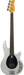 Electric bass guitar with a silver body and yellow pickguard on a white background